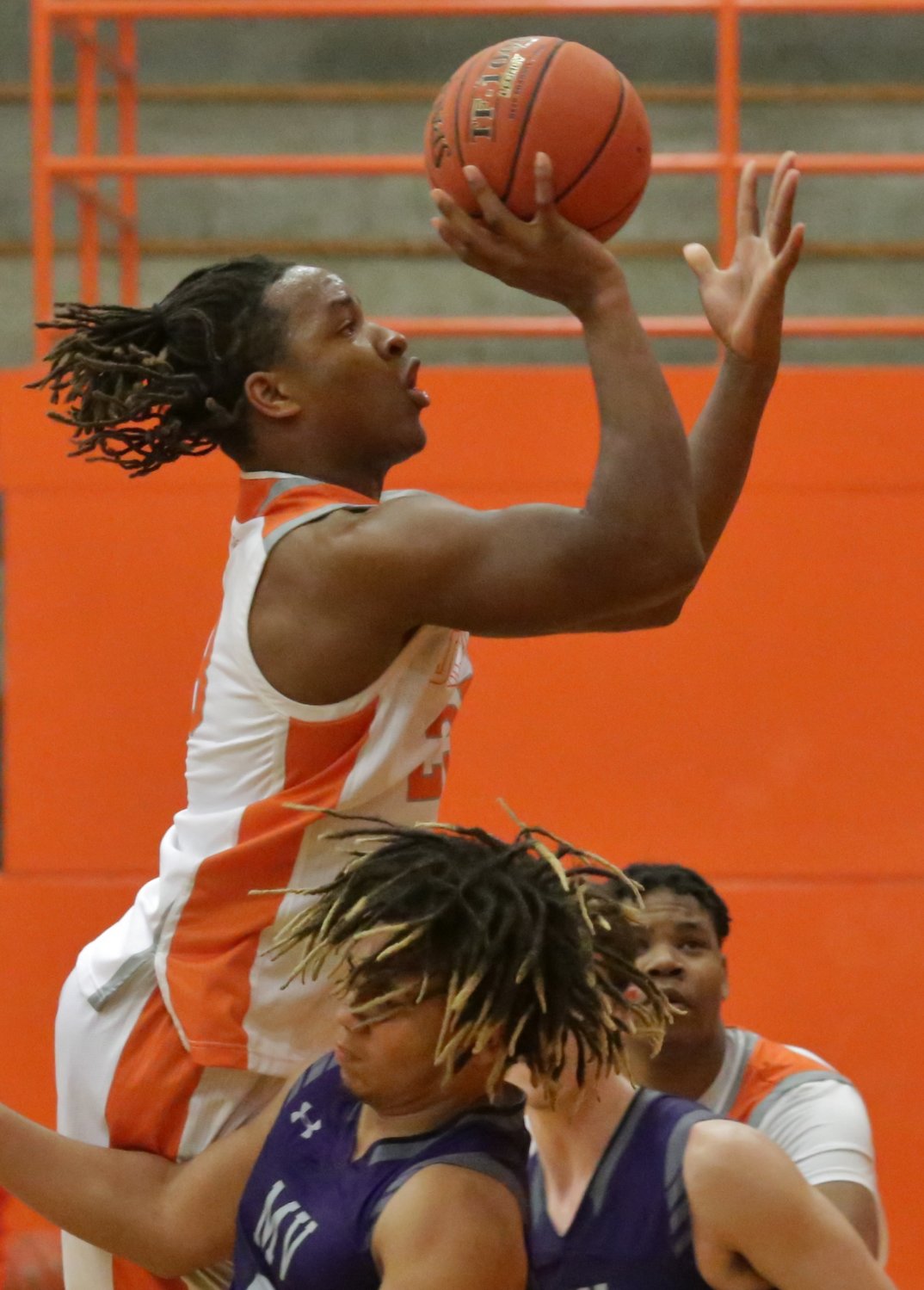 Mineola’s Trevion Sneed elevates to the basket in action against Mount Vernon.
